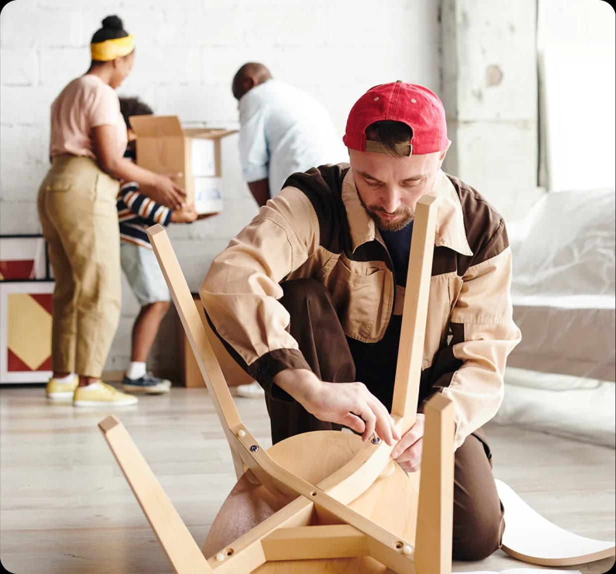 Carpentry team assembling furniture in a home