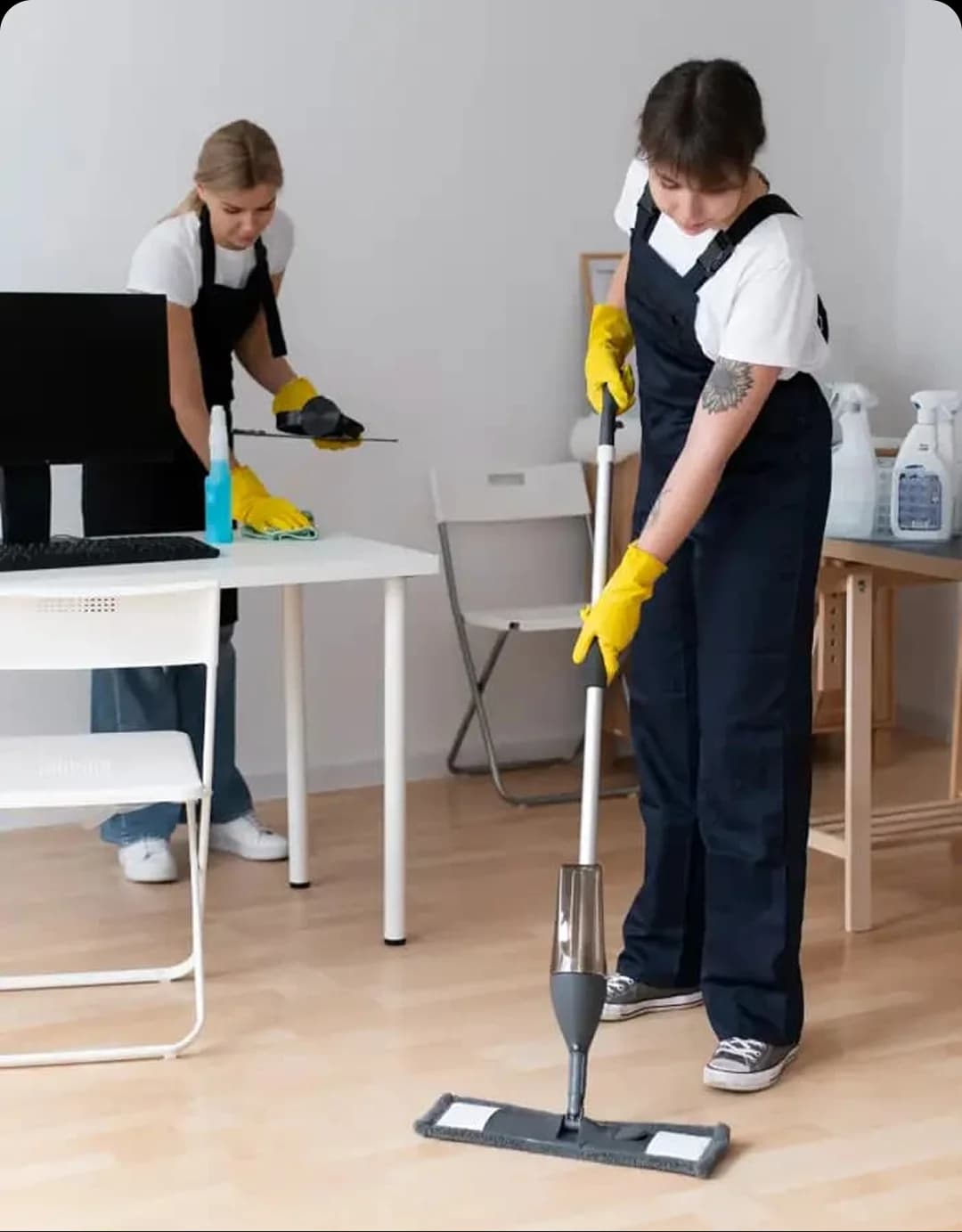 Cleaners refreshing a home office