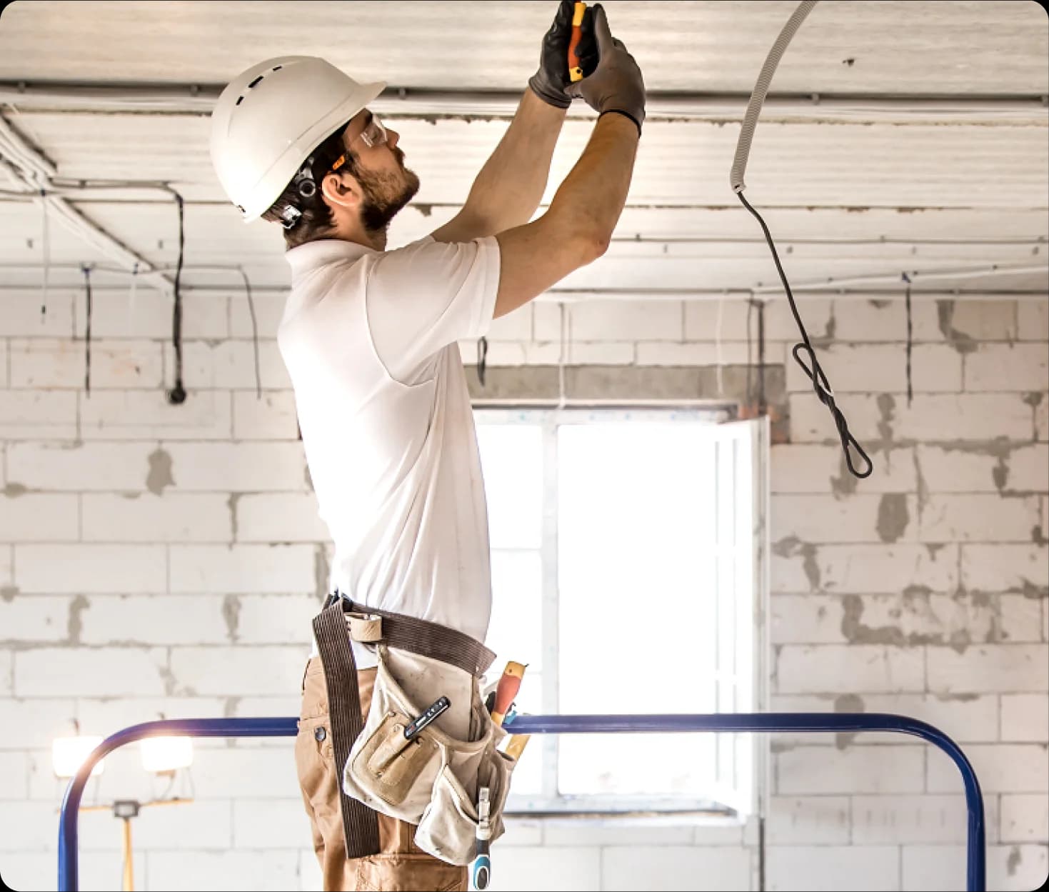 Electrician working on a ceiling installation