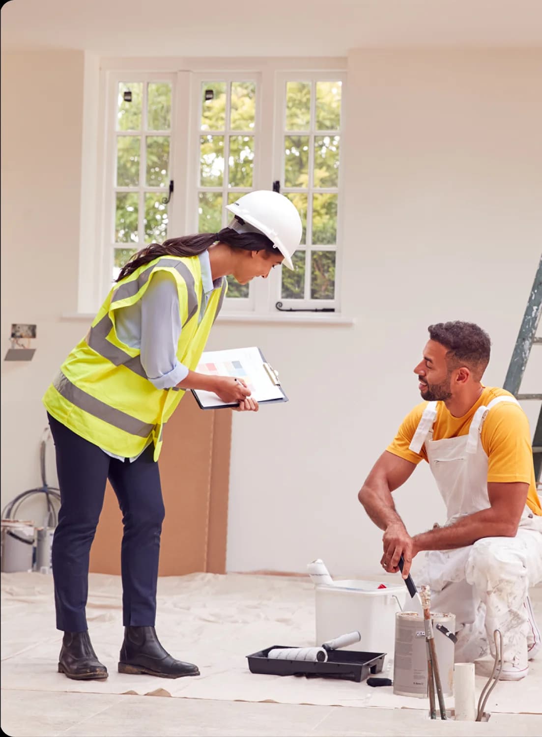 Renovation team planning interior painting